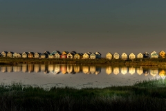 Hengistbury Head beach huts at sunset